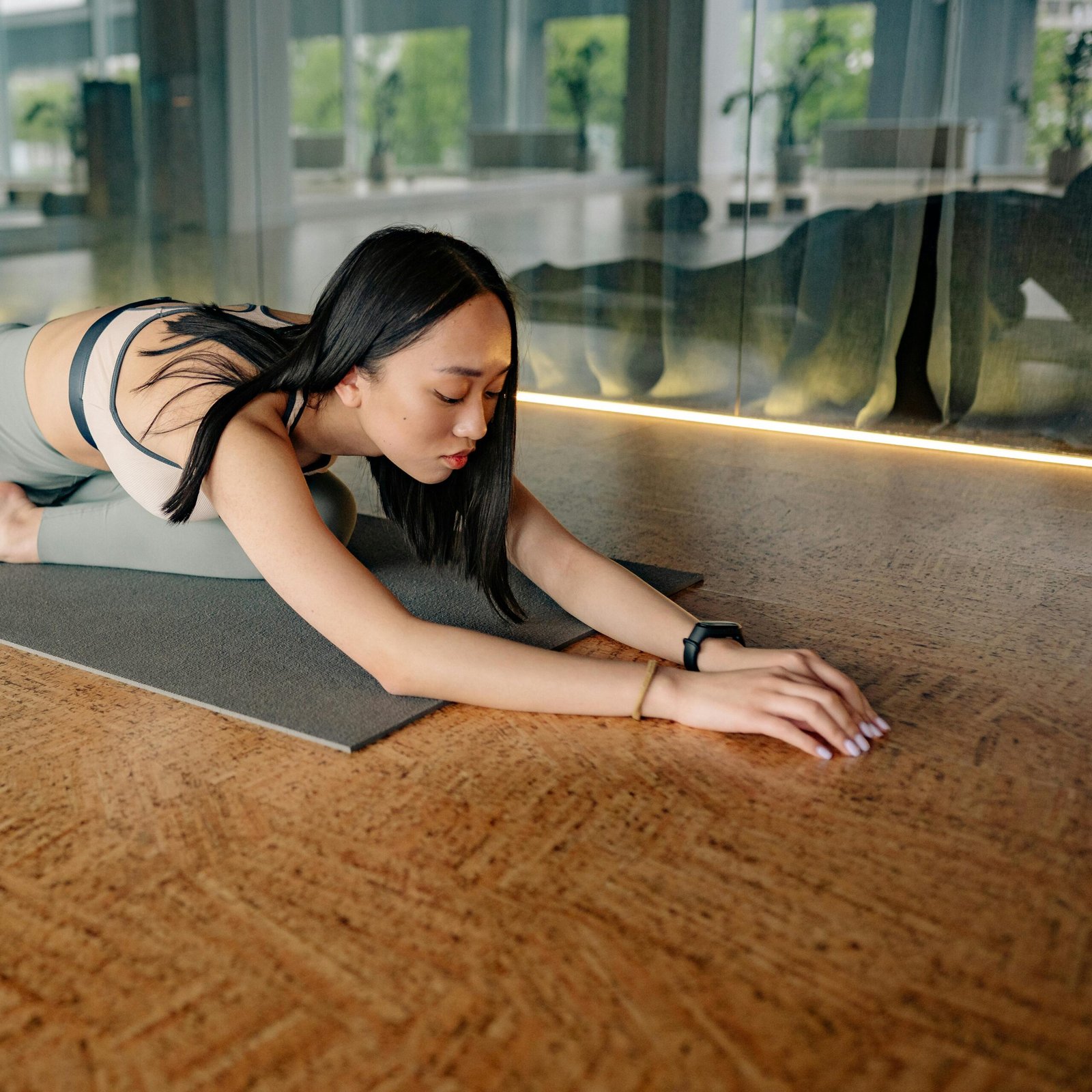 girl doing yoga stretching forward